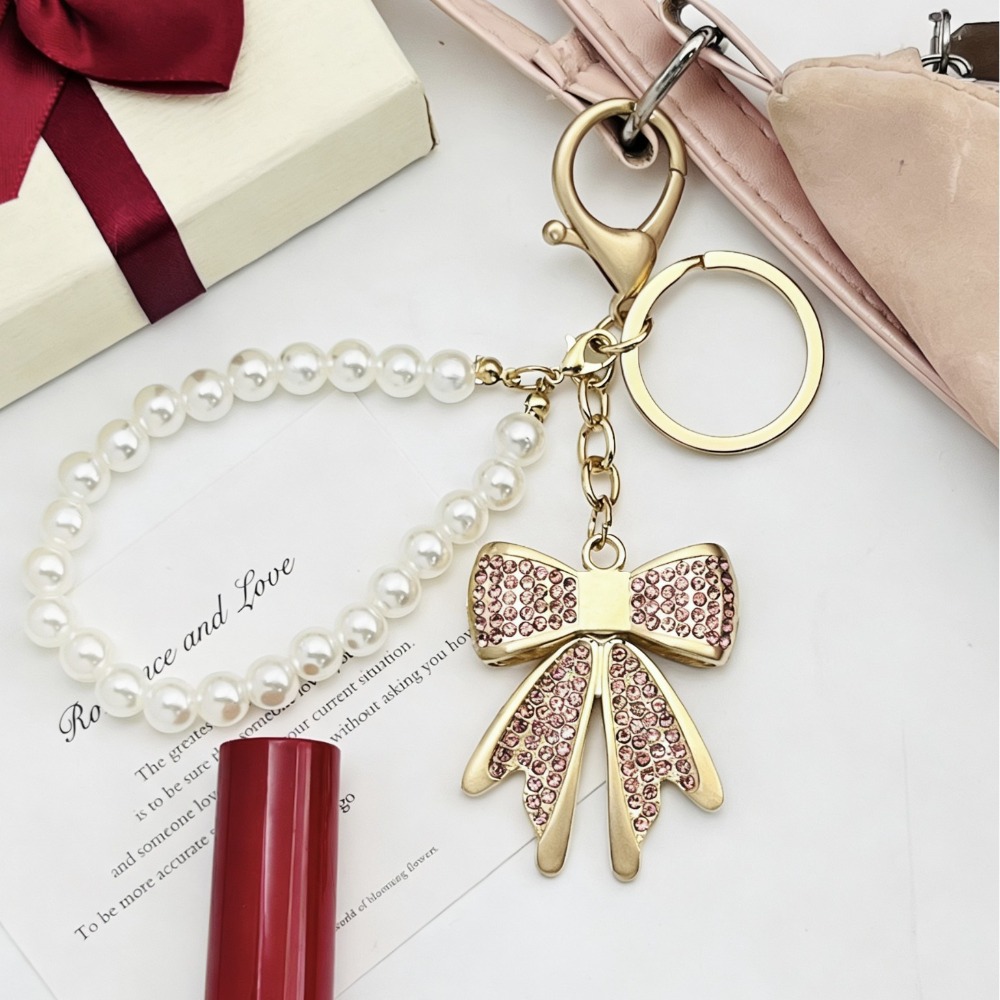 2 個ファッションかわいい弓蝶キーホルダー光沢のあるラインス - Luxury Bags Girls のレビューと価格